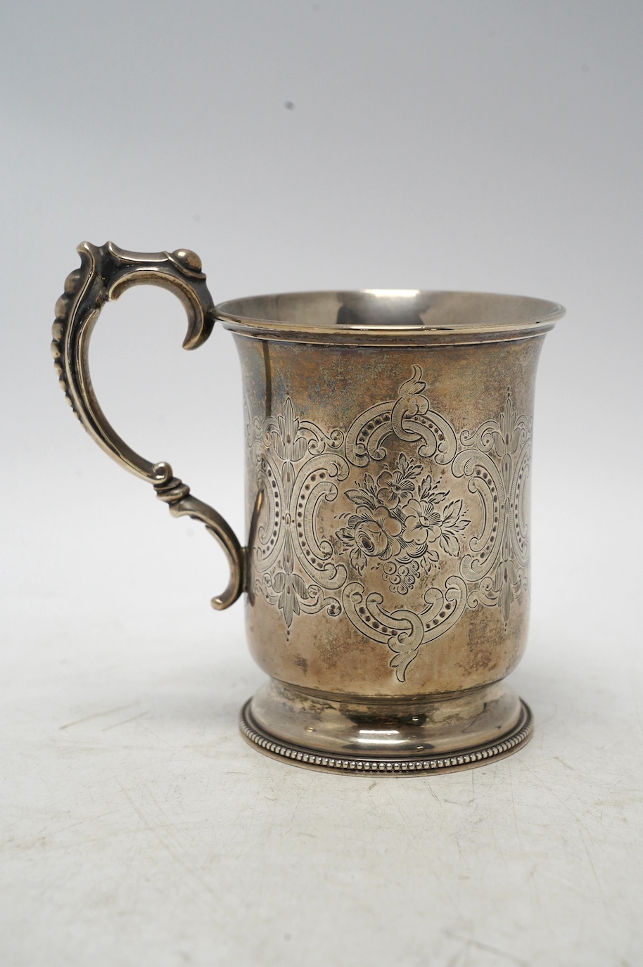 A Victorian engraved silver christening mug, by Edward Charles Brown, London, 1872, 11cm, 5.4oz. Condition - fair to good